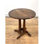 An Arts and Crafts period elm and cherry book table of pegged and jointed construction, circa