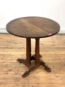 An Arts and Crafts period elm and cherry book table of pegged and jointed construction, circa