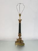 An Empire style gilt-metal mounted table lamp, modern, on tri-form platform base, the tapering