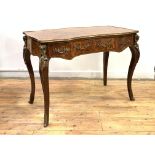 A kingwood bureau plat in the Louis XV taste, 20th century, of serpentine outline, the marquetry top