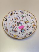 A Chinese famille rose porcelain plate, probably 19th century, the well and rim decorated with