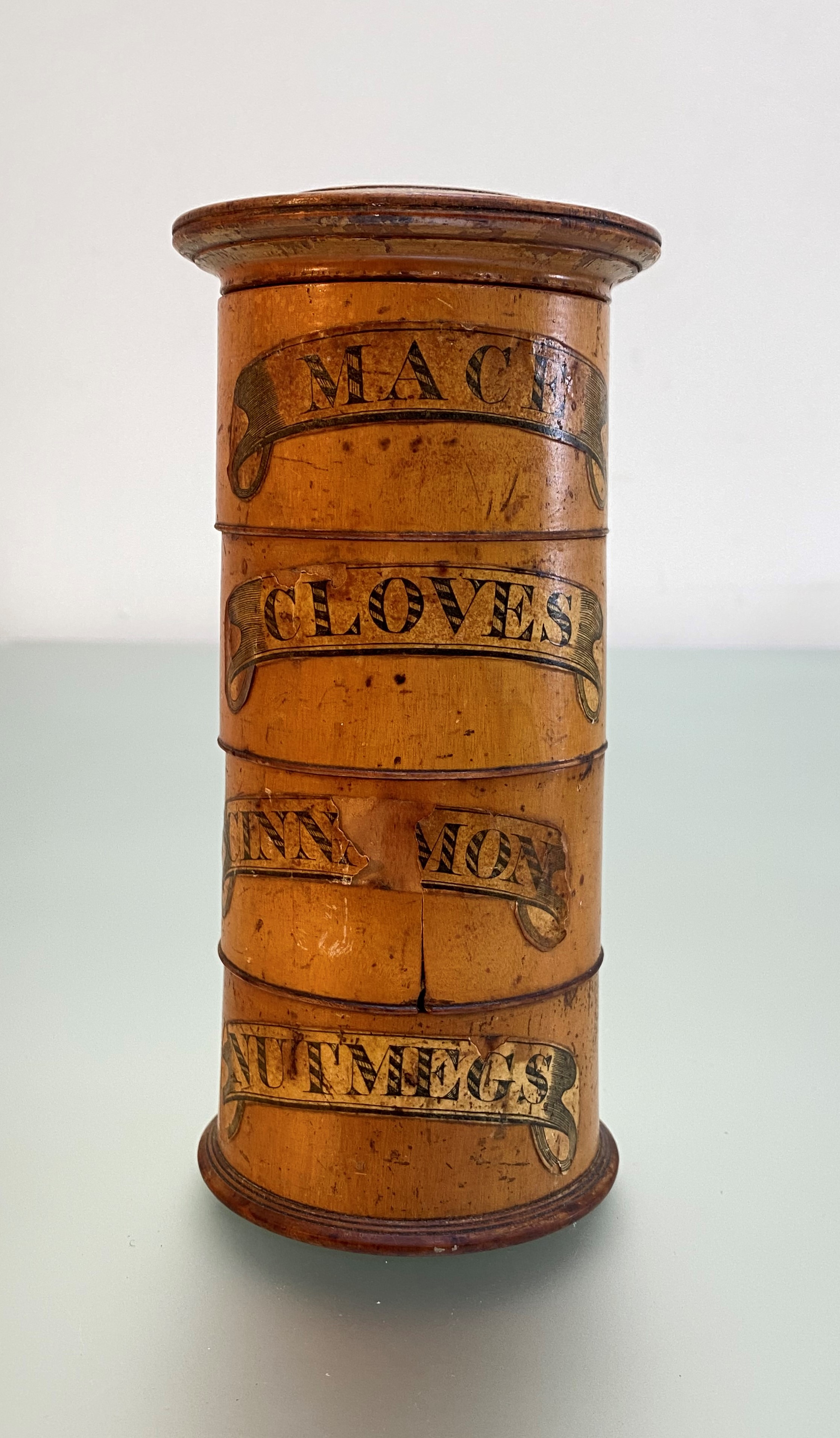 A late 19th century treen spice tower, of tapering cylindrical form, with four named sections, "