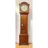 A Scottish Regency mahogany longcase clock, the arched hood with gilt brass finials above an