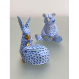 Two Herend porcelain animal models in the blue fishnet pattern, highlighted with gilding: the