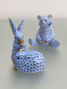 Two Herend porcelain animal models in the blue fishnet pattern, highlighted with gilding: the