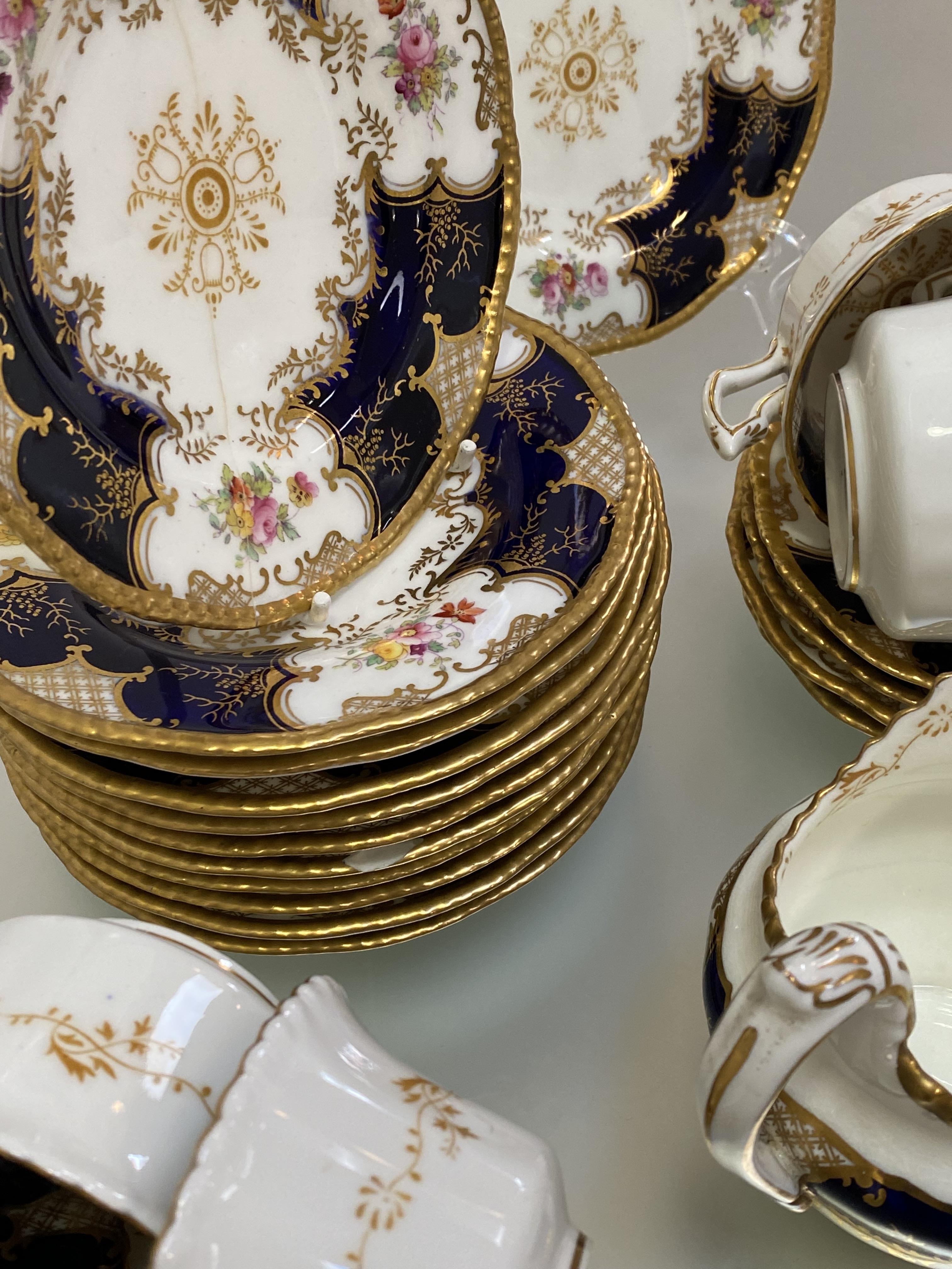 A Coalport Batwing 2665 pattern tea service, c. 1900, comprising: eleven cups, twelve saucers, - Image 3 of 7