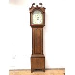 A George III oak longcase clock, early 19th century, the hood with swan neck pediment over fluted