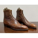 A pair of gentleman's brown leather ankle boots, c. 1900/1910, with their original brass-mounted