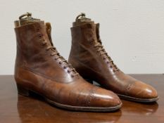 A pair of gentleman's brown leather ankle boots, c. 1900/1910, with their original brass-mounted