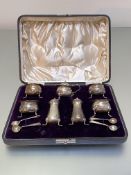 A cased Victorian silver condiment set, John Round & Son Ltd., Sheffield 1898, comprising four