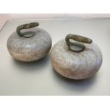 A pair of granite curling stones, of characteristic form. Diameter 28cm