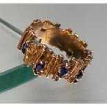 A vintage sapphire-set 9ct gold ring, the textured bark band claw-set with marquise-cut sapphires.