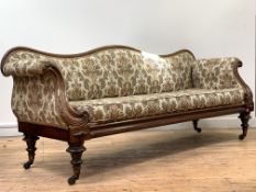 A William IV rosewood framed sofa, the serpentine crest rail over back arms and seat upholstered