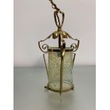 An Art Nouveau style brass and vaseline glass hanging lantern in the manner of W.A.S. Benson, the