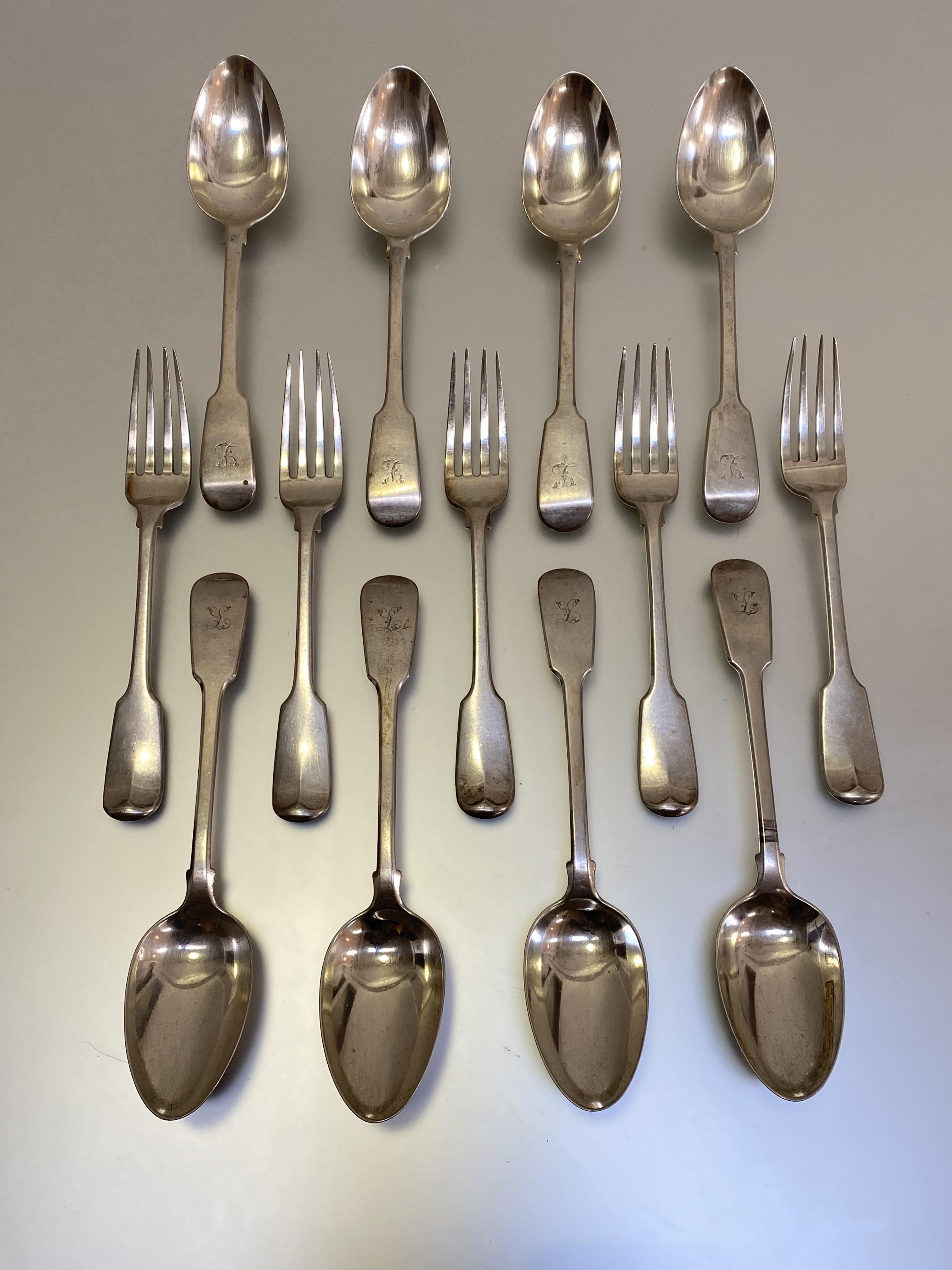 A set of eight George III Fiddle pattern table spoons, Paul Storr, London 1816, each engraved with a