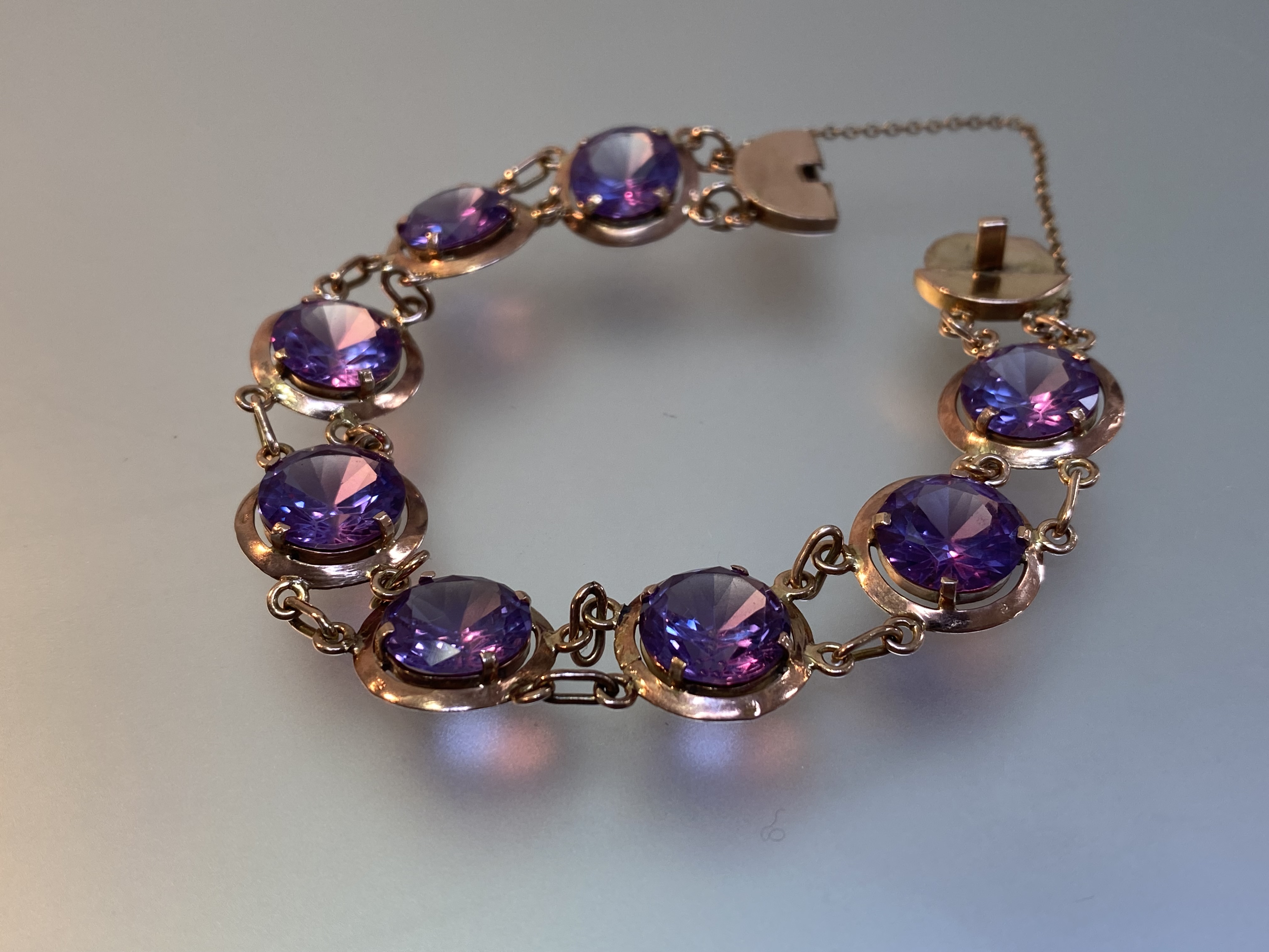 An amethyst bracelet, the eight uniform round-cut stones claw-set in conforming yellow metal discs - Image 2 of 5