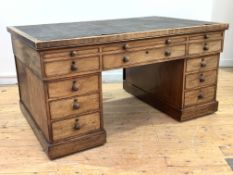 A mid-19th century mahogany twin pedestal partners desk, the top inset with tooled skiver writing