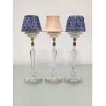 A set of three Clarke's Patent Cricklite cut and pressed glass candleholders, c. 1900, each with