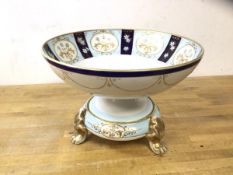 A Noritake footed bowl on tripod support, having paw feet, combined height 18cm , 25cm diameter