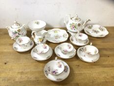 A 19thc tea service with teapot, measures 12cm high, six small teacups and saucers, milk jug,