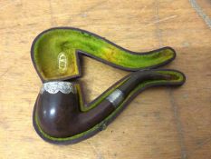 A 19thc wooden pipe with silver mounted rim and collar, initialled JBB, with original case, measures