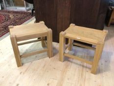 A pair of oak side tables, rectangular tops on square raised supports united by box stretcher,