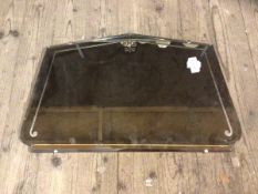 A wall mirror with bevelled edge with pediment top and textured border, measures 40cm x 65cm a/f
