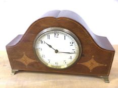 An inlaid mahogany mantel clock on brass feet, measures 15cm x 23cm x 7cm