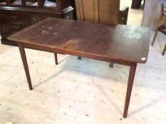 A Nils Jonsson for Troeds mid century teak extending dining table with two extra leaves, raised on