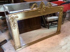 A 19thc ornate gilt framed over mantel mirror with shell and scrolled acanthus surmount, with a