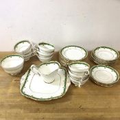 A Paragon tea set including nine teacups, each measuring 6cm high, with nine saucers, nine side