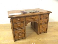 A miniature oak pedestal desk, the writing surface inscribed Presented to the Chief Draughtsman with