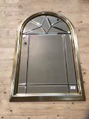 A modern Florentine style wall mirror, each panel bevelled with scroll surmounts and parcel gilt and