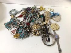 A quantity of costume jewellery including a turquoise necklace, beads, brooches, watches, bracelets,