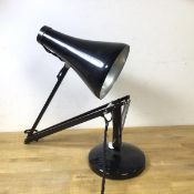 An anglepoise desk lamp by Herbert Terry & Sons ltd, on circular base with conical shade, stamp to