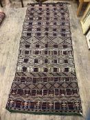 A Moroccon Kelim with alternating bands of geometric patterns, measures 380cm x 160cm a/f
