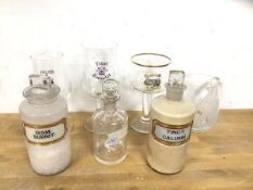 Three vintage apothecary bottles, tallest measures 21cm high, along with four branded beer