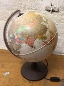 A c2010 terrestrial globe table lamp, stamped Nova Rico to base, measures 45cm high