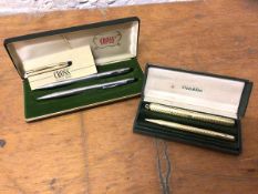 A Cross pen and mechanical pencil in original box and a Conklin fountain pen and pencil, both with