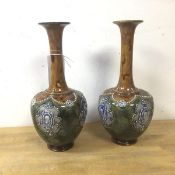 A pair of 20thc Royal Doulton bottle shaped vases, each measures 26cm high