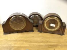 A group of three 1920's Smith's mantel clocks, each with domed top and face, largest measures 24cm x