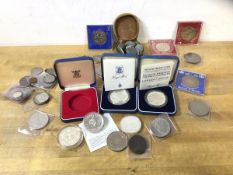 A collection of coins including two silver proof coins of the Prince and Princess of Wales, a