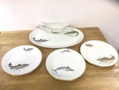 A Pontesa fish service including six plates, each with different fish, measuring 23cm diameter,