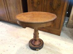 A Victorian occasional table with oval mahogany top with dished edge over plain frieze on turned