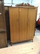 A mid century teak AC Handcraft triple door wardrobe with two doors in front of hanging space,