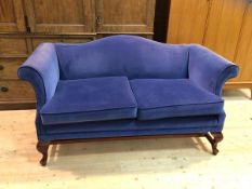 A Georgian inspired two-seater sofa, the humped back over scrolled arms and two seat cushions, on