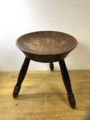 A vintage tripod stool with poker work top having thistle decoration and inscribed touch me wha daur
