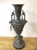 A cast metal Egyptian inspired vase, on circular base, measures 50cm high