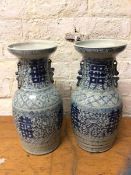 A pair of blue and white Chinese vases with dished rims, no marks to base, one with repairs,