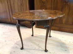 A walnut Queen Anne inspired Sutherland table, the drop leaf top with undulating moulded edge on